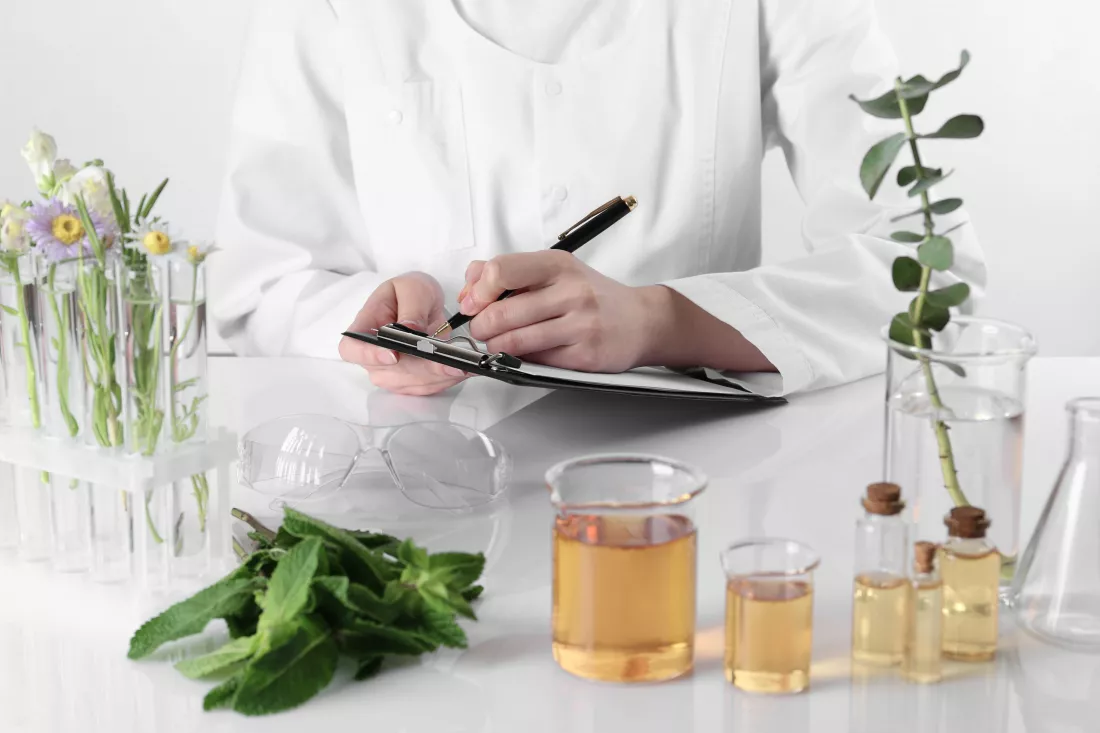 aromatherapy-product-scientist-developing-essential-oils-white-table-laboratory-closeup(1)